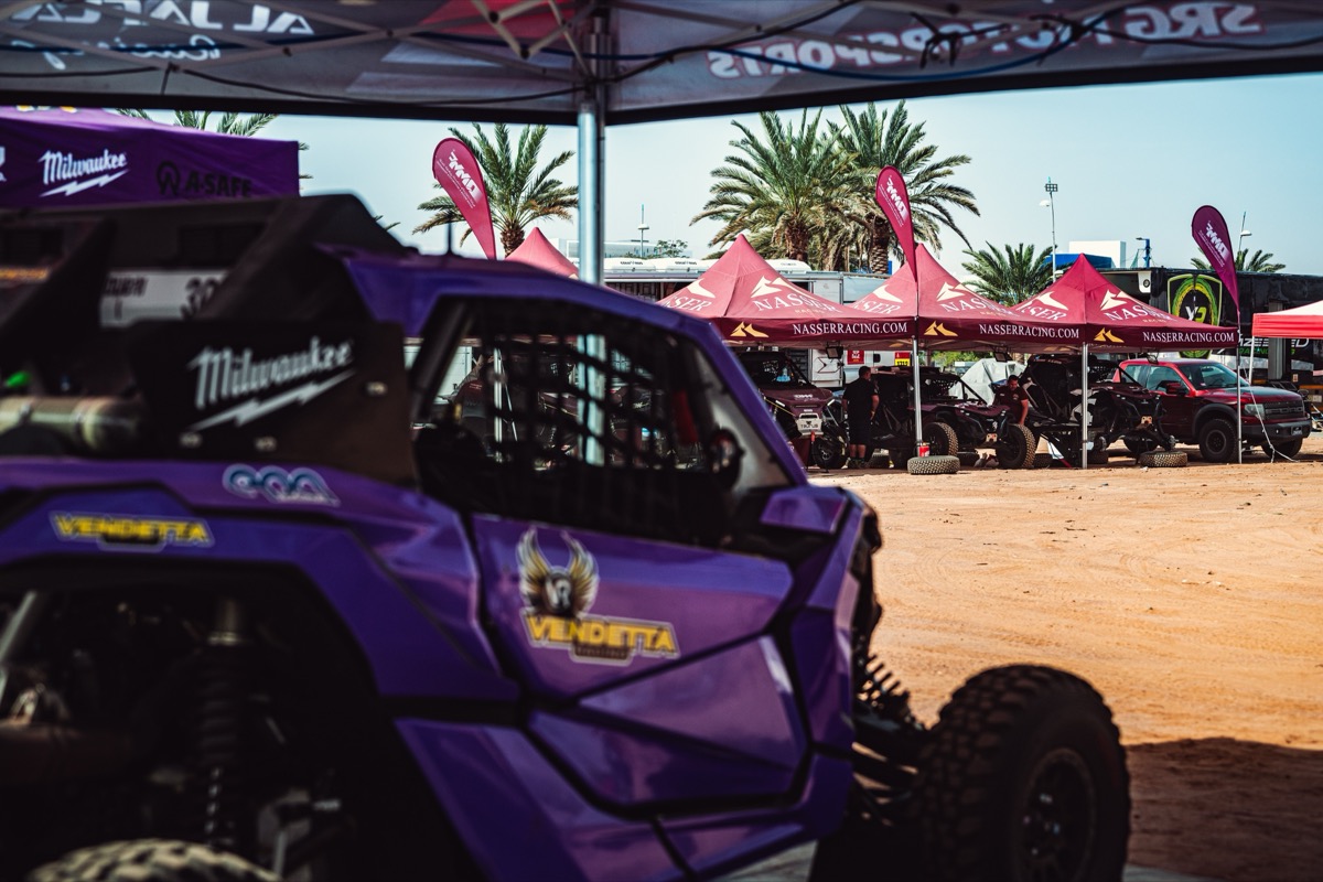 Aqaba paddock view from inside the Vendetta tent, looking out across the Nasser Racing setup.