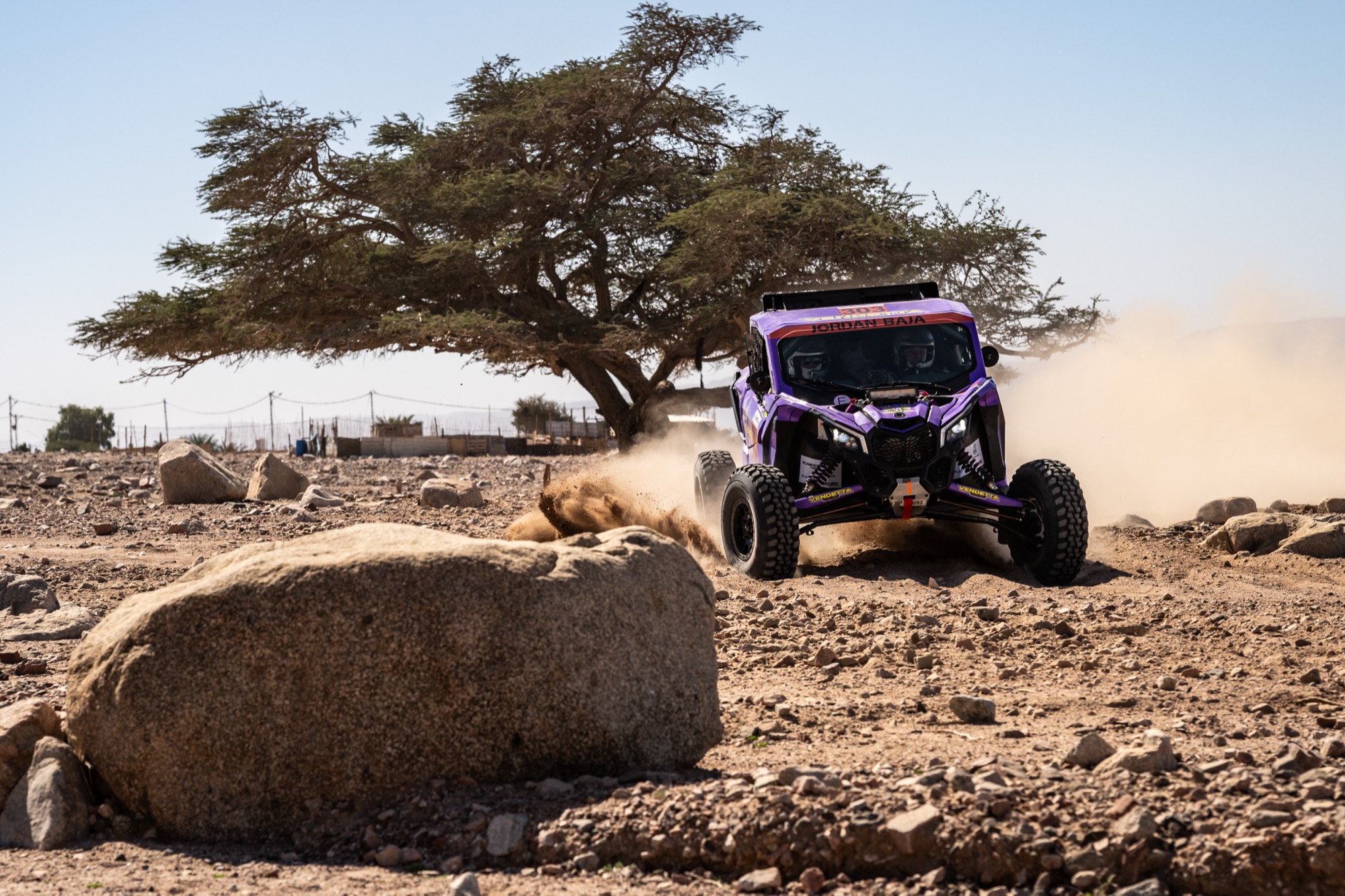 Vendetta Racing UTV at Jordan Baja 2026, sliding past a lone acacia tree in the Wadi Rum desert. Photo by Edo Bauer.